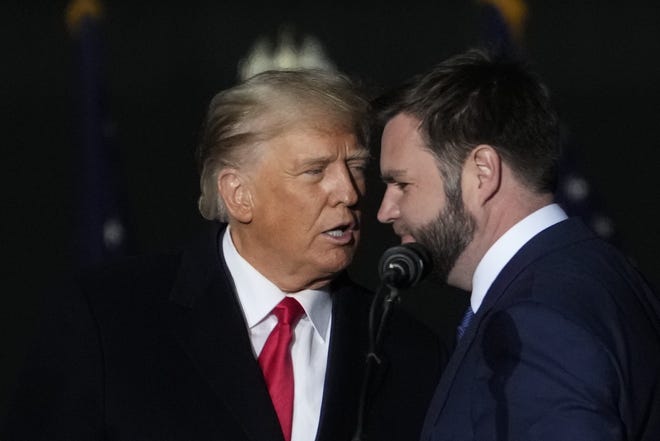 Former President Donald Trump and Republican candidate for U.S. Senate J.D. Vance greet supporters during the rally at the Dayton International Airport on Nov. 7, 2022 in Vandalia, Ohio.